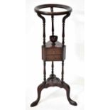 An Edwardian mahogany three-tier shaving stand on turned columns, height 86cm. Condition Report: