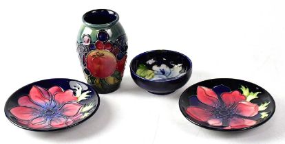 MOORCROFT; four items, comprising two 'Anemone' pattern dishes, diameter of each 116cm, both