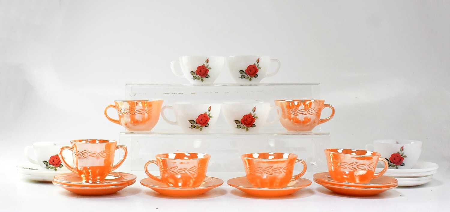 A Fire-King peach lustre tea set and a Pyrex 'June Rose' pattern set of teacups and saucers.