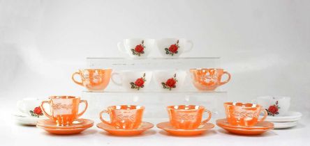 A Fire-King peach lustre tea set and a Pyrex 'June Rose' pattern set of teacups and saucers.