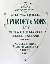 A reproduction enamel advertising shield-shaped wall sign for J. Purdey & Sons Ltd, height 51cm,
