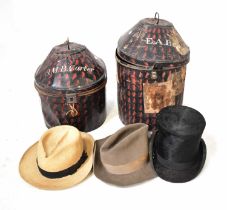 Two similar black painted hat boxes, one inscribed to the lid 'J.M.B. Carter', containing a sealskin