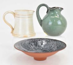 † HUMPHREY WAKEFIELD; three studio pottery items comprising an oatmeal ground jug, height 9cm, a