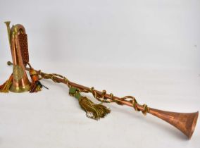 A copper and brass bugle with emblem for Argyll and Sutherland with twisted rope to handle, length