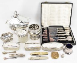 Silver and silver plated items to include four mixed silver topped dressing table glass boxes, a