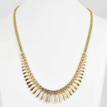 A 9ct gold frilled drop necklace, length 42cm, approx. 10.8g. Condition Report: Fixing clasp is