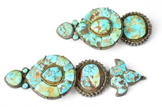 A pair of Tibetan turquoise ear jewels, with hook fittings to the reverse for fastening to the hair,