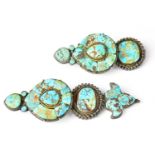 A pair of Tibetan turquoise ear jewels, with hook fittings to the reverse for fastening to the hair,
