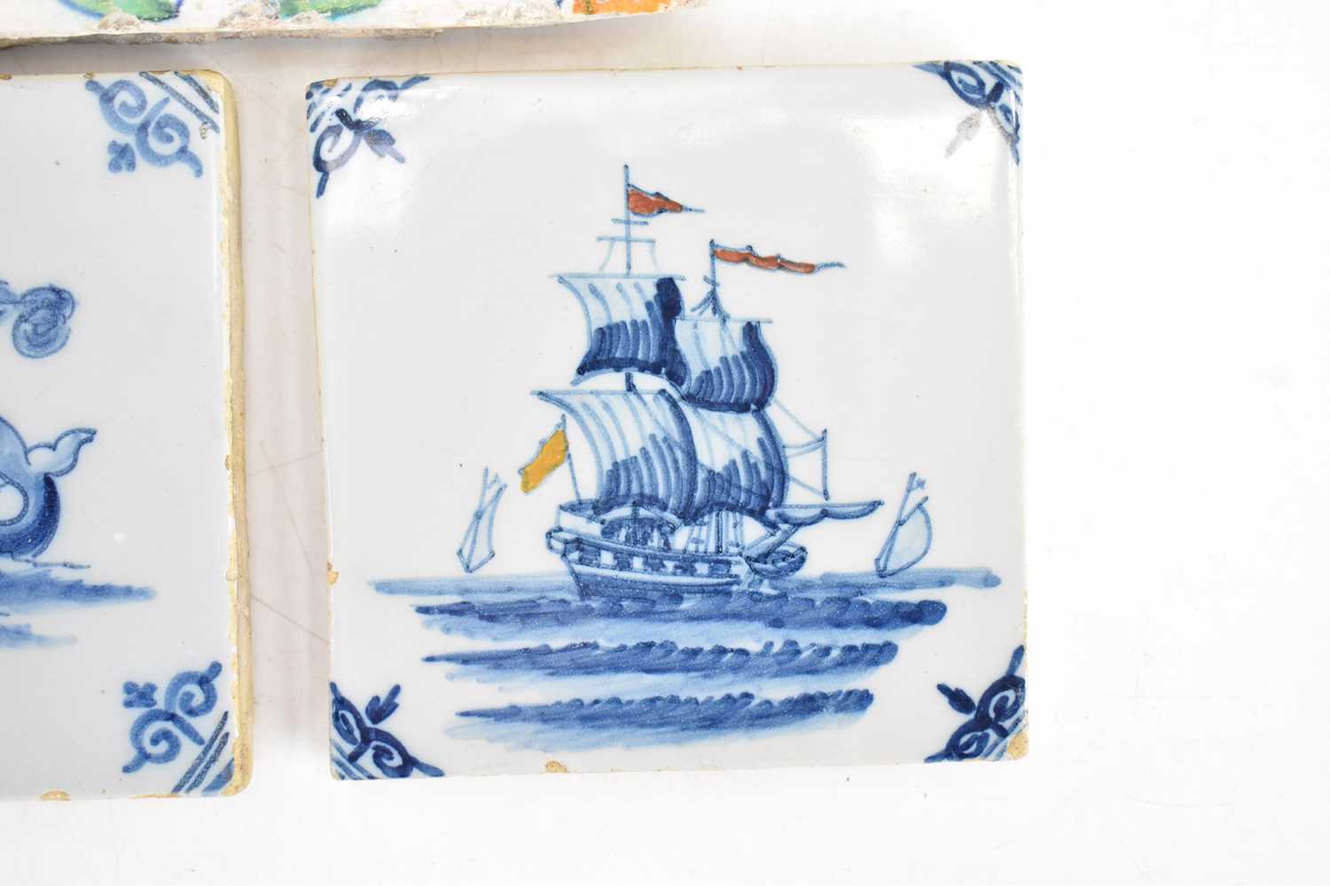 Three 18th century tin glazed tiles comprising a large polychrome decorated tulip and floral pattern - Image 6 of 7