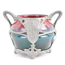 An Art Nouveau inspired pot with two-tone high fired glazed body, in naturalistic pewter basket,