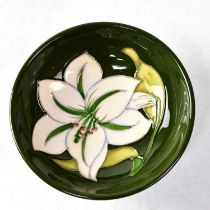 MOORCROFT; a small bowl in the 'Bermuda Lily' design, with impressed and painted marks to base,