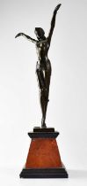 A Chiparus-style bronze figure of a dancer with arms raised, on a marble base, signed D. H. Chiparus