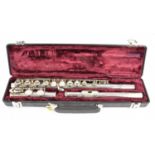 BUFFET CRAMPON; a silver plated three-piece cased flute, marked Cooperscale AKC E. Condition Report: