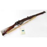 ENFIELD; a deactivated Lee Enfield .303" S.M.L.E. fully stocked bolt action rifle with canvas sling,