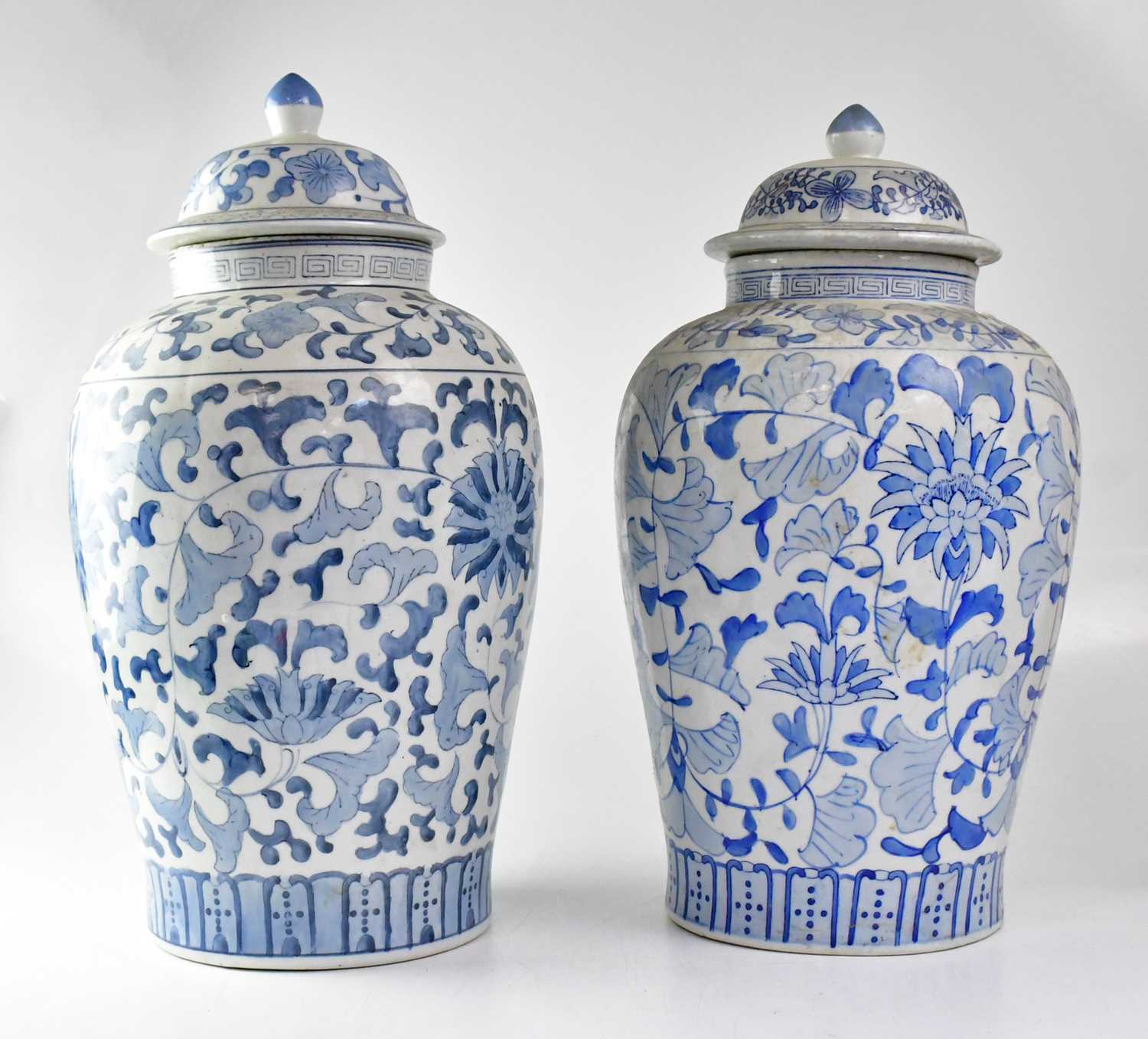 A large 20th century Chinese blue and white ginger jar and cover painted with flowers and scrolls,