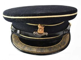 ALKIT, SERVICE & CIVILIAN OUTFITTERS; a peaked cap with Royal Pay Corps badge, size 7 1/4 (af).