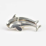 GEORG JENSEN; a small silver brooch, no. 317B, in the form of two leaping dolphins, marked to the