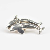 GEORG JENSEN; a small silver brooch, no. 317B, in the form of two leaping dolphins, marked to the