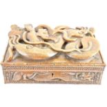 A large wooden box with carved dragon and serpent lid, with internal tray and loose dividers, 12 x