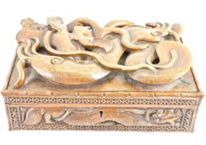 A large wooden box with carved dragon and serpent lid, with internal tray and loose dividers, 12 x