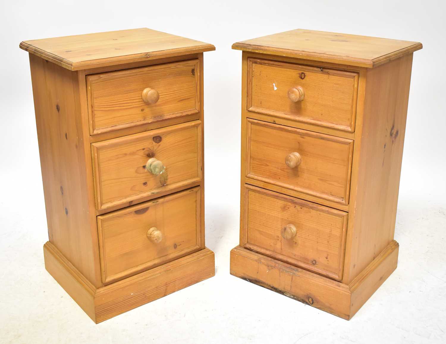 A pair of pine bedside drawers, with three drawers to plinth base, 167 x 38.5 x 33cm, a Chinese-