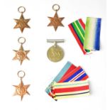A group of WWII medals, comprising a British War Medal, a 1939-45 Star, an Atlantic Star, a