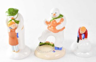 THE SNOWMAN; three Coalport Characters figures, comprising 'Building The Snowman', 'Dancing with