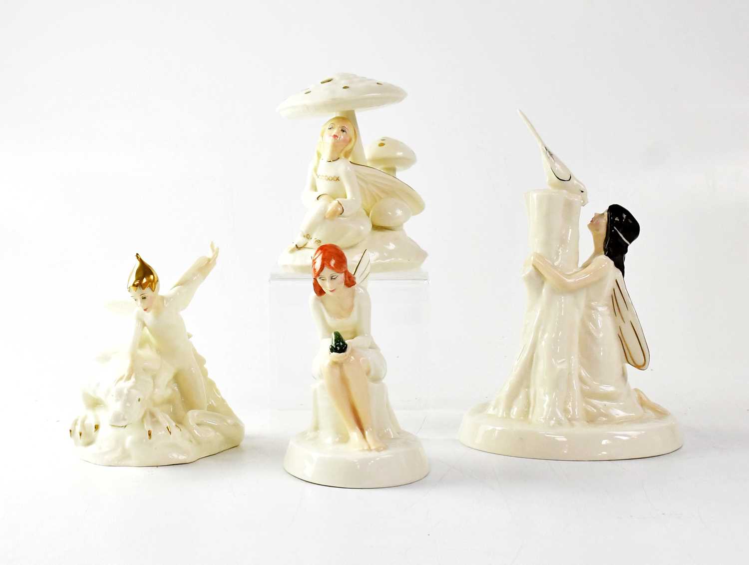 ROYAL DOULTON; four figures from the Enchantment collection comprising HN3024 'April Shower', HN2979