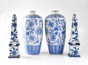 A pair of 20th century Chinese blue and white vases of shouldered tapering form, painted with
