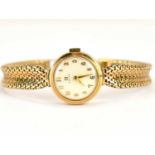 OMEGA; a ladies' 9ct gold wristwatch, the white dial set with Arabic numerals, crown wind