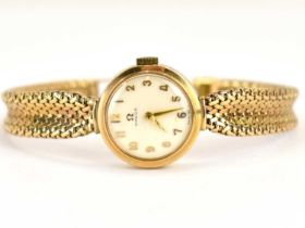 OMEGA; a ladies' 9ct gold wristwatch, the white dial set with Arabic numerals, crown wind