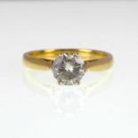 An 18ct yellow gold diamond solitaire ring, the claw set diamond approx. 1ct, suggested colour K and