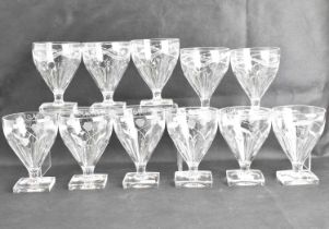 Two sets of similar shaped rummer glasses, with cone-shaped bowls with moulded fluted bottoms,