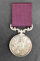 A Victorian military medal 'For Long Service and Good Conduct', awarded to Sergeant Edward Earl of