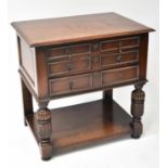 A Victorian oak three-drawer side table with moulded top above three graduated drawers, raised on