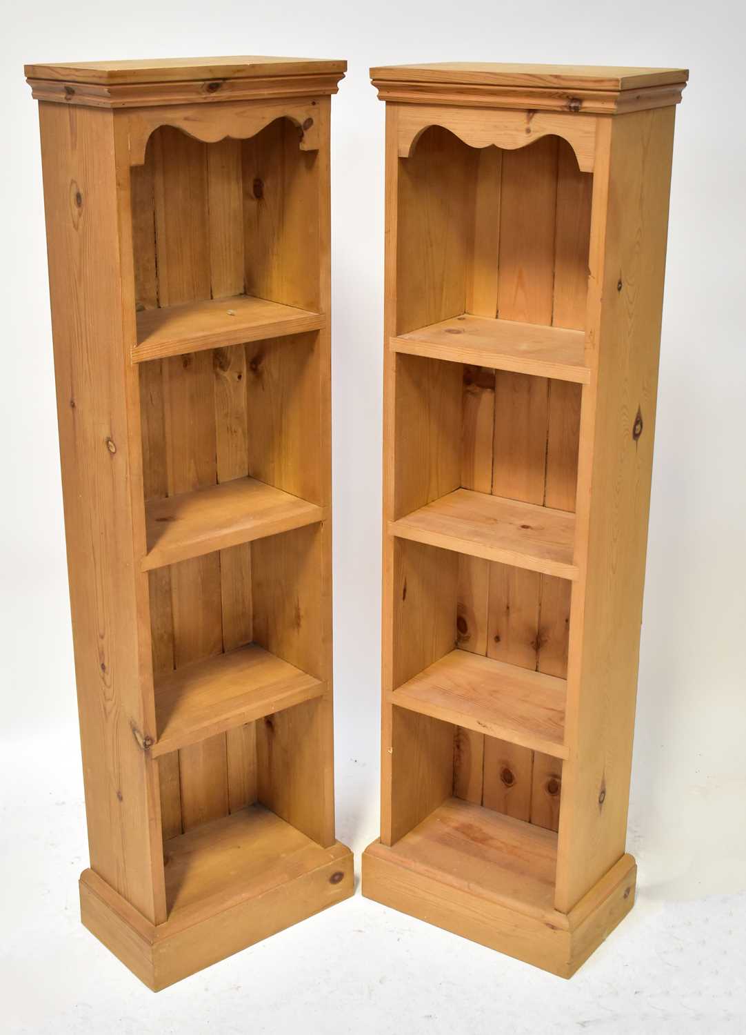 A pine bookcase of three shelves with reeded supports, 107 x 59 x 22.5cm, together with a pair of - Image 2 of 2