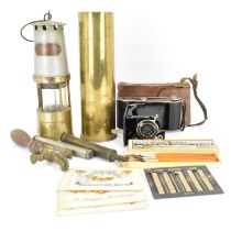 A collectors' lot to include a brass artillery shell, 28 x 8cm, a miners' safety lamp, a box of