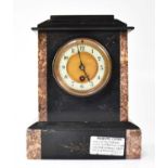 An early 20th century thirty-hour black slate and marble mantel clock, the white enamelled dial