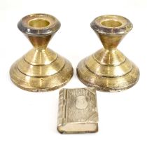 A pair of Art Deco style short hallmarked silver loaded candlesticks, 6 x 7cm, together with a