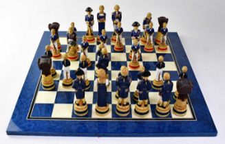 A Studio Anne Carlton 'Battle of Trafalgar' painted chess set, boxed, together with an associated