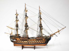 A scale model of HMS Victory, on stand, with rigging, height 77cm, length 104cm.