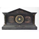 A Victorian slate mausoleum eight-day mantel clock with bronze-effect panels depicting Classical