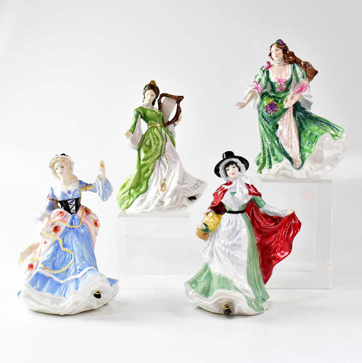 ROYAL DOULTON; four female figures from the 'Ladies of the British Isles' series, comprising