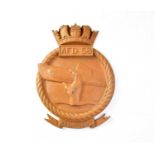 A cast alloy wall plaque inscribed 'AFD 58' depicting a hand holding a submarine with scrolling