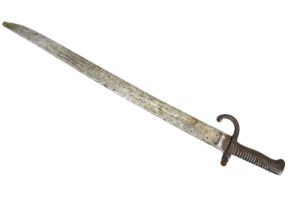 A late 19th century French Chassepot bayonet with ribbed handle and scabbard.