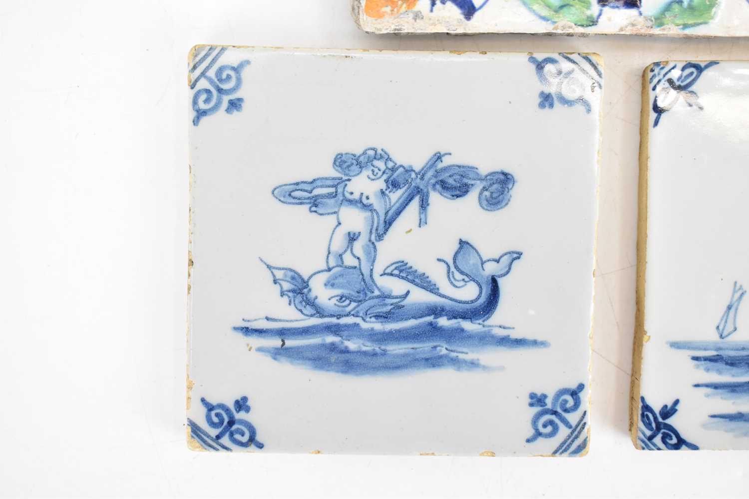 Three 18th century tin glazed tiles comprising a large polychrome decorated tulip and floral pattern - Image 3 of 7