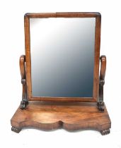 A 19th century mahogany swing toilet mirror with rectangular mirror plate, on scrolling supports