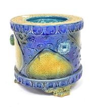 RAYMOND POWER; a ceramic planter in the Majolica style, embossed with naturalistic motifs to the
