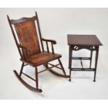 † An American red walnut rocking chair upholstered with tooled leather and studded back and seat,