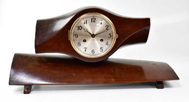 An unusual eight-day mantel clock fashioned from a mahogany propeller, fitted with 5.5 inch silvered